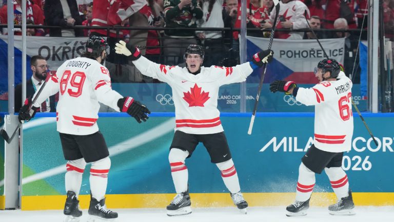 Bo Horvat (14) of Team Canada celebrates his goal against Team Czechia with Drew Doughty (89) and Brad Marchand (63) during second period men's Olympic hockey action at the 2026 Milan Cortina Winter Olympics in Milan, Italy on Thursday, February 12, 2026. (Nathan Denette/CP)