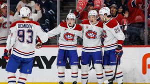Montreal Canadiens' Oliver Kapanen (second right) celebrates his goal against the Winnipeg Jets with Ivan Demidov, left to right, Lane Hutson and Juraj Slafkovsky during first period NHL action in Winnipeg, Wednesday, Feb. 4, 2026. (John Woods/CP)