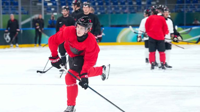 Canada forward Macklin Celebrini shoots the puck at practice during the 2026 Milan Cortina Winter Olympics in Milan. (Nathan Denette/THE CANADIAN PRESS)