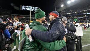 Saskatchewan Roughriders head coach Corey Mace and Montreal Alouettes head coach Jason Maas embrace following second half CFL football action at the 112th Grey Cup, in Winnipeg on Sunday, Nov. 16, 2025. (Fred Greenslade/CP)