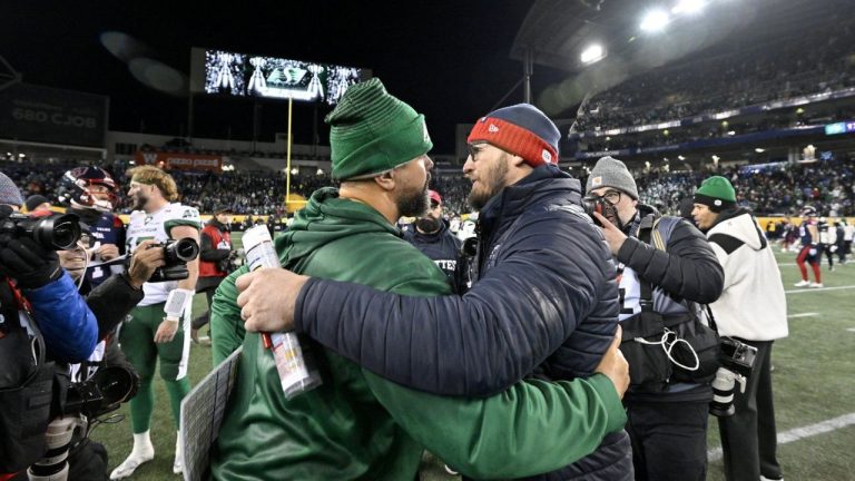 Saskatchewan Roughriders head coach Corey Mace and Montreal Alouettes head coach Jason Maas embrace following second half CFL football action at the 112th Grey Cup, in Winnipeg on Sunday, Nov. 16, 2025. (Fred Greenslade/CP)