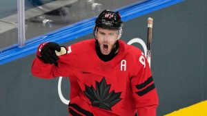 Canada's Connor McDavid celebrates after scoring his sides first goal during a preliminary round match of men's ice hockey between Canada and Switzerland at the 2026 Winter Olympics, in Milan, Italy, Friday, Feb. 13, 2026. (Hassan Ammar/AP)