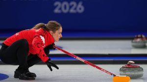 Canada's Jocelyn Peterman in action, during the mixed doubles round robin phase of the curling competition against the Czech Republic, at the 2026 Winter Olympics, in Cortina d'Ampezzo, Italy, Wednesday, Feb. 4, 2026. (Fatima Shbair/AP)
