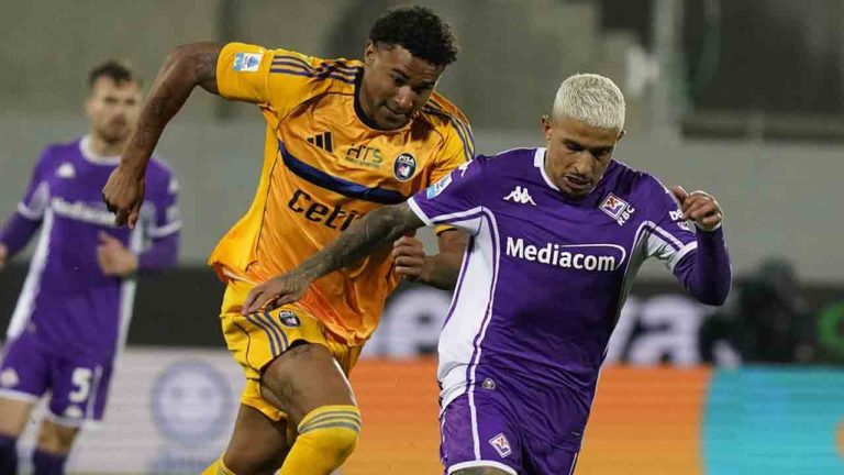 Fiorentina's Dodo, right, and Pisa's Henrik Meister in action during the Serie A soccer match between Pisa and Fiorentina, in Florence, Italy, Monday, Feb. 23, 2026. (Marco Bucco/LaPresse via AP)