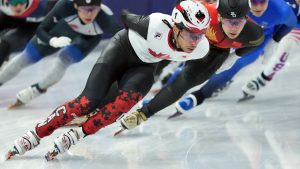Canada's William Dandjinou competes in the Men's semifinal 1500m Short Track Speed Skating event during the 2026 Milan Cortina Winter Olympics in Milan, Italy on Saturday, February 14, 2026. (Nathan Denette/THE CANADIAN PRESS)