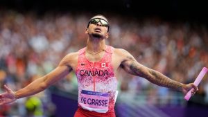 Andre de Grasse, of Canada, celebrates after winning the men's 4 x 100-meter relay final at the 2024 Summer Olympics, Friday, Aug. 9, 2024, in Saint-Denis, France. (Petr David Josek/AP)