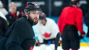 Canada defenceman Drew Doughty looks up ice at practice during the 2026 Milan Cortina Winter Olympics in Milan. (Nathan Denette/THE CANADIAN PRESS)
