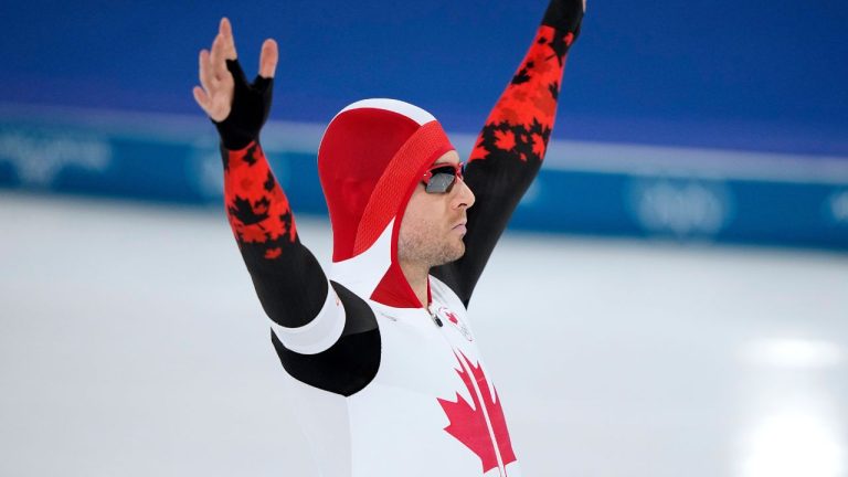 Laurent Dubreuil of Canada greets fans prior to competing in the men's 500 meters speedskating race at the 2026 Winter Olympics, in Milan, Italy, Saturday, Feb. 14, 2026. (Ben Curtis/AP Photo)