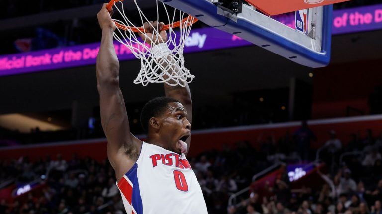 Detroit Pistons centre Jalen Duren hangs from the rim after dunking against the Boston Celtics during the second half of an NBA basketball game Monday, Jan. 19, 2026, in Detroit. (Duane Burleson/AP)