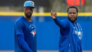Toronto Blue Jays' Vladimir Guerrero Jr., right, gives Eloy Jimenez first base pointers during a drill at Spring Training in Dunedin, Fla., on Thursday, Feb. 19, 2026. (Frank Gunn/CP)