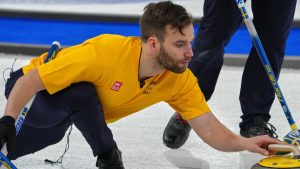 Sweden's Oskar Eriksson in action during the men's curling round robin session against Canada, at the 2026 Winter Olympics, in Cortina d'Ampezzo, Italy, Friday, Feb. 13, 2026. (Misper Apawu/AP Photo)