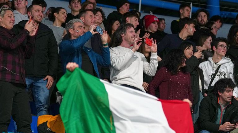 Fans of Italy cheer during the mixed doubles round robin phase of the curling competition between Italy and Estonia at the 2026 Winter Olympics, in Cortina d'Ampezzo, Italy, Friday, Feb. 6, 2026. (Misper Apawu/AP Photo)