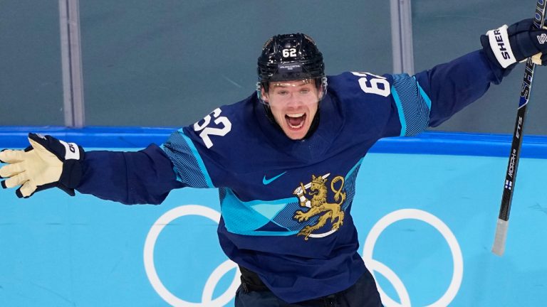 Finland's Artturi Lehkonen (62) celebrates after scoring his side's third goal during a men's ice hockey quarterfinal game between Finland and Switzerland at the 2026 Winter Olympics, in Milan, Italy, Wednesday, Feb. 18, 2026. (Petr David Josek/AP)