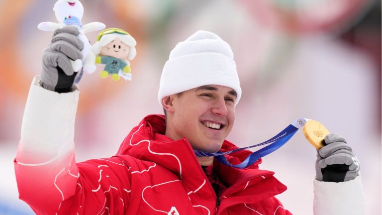 Switzerland's Franjo von Allmen poses with the gold medal of a men's super-G race, at the 2026 Winter Olympics, in Bormio, Italy, Wednesday, Feb.11, 2026. (Julia Demaree Nikhinson/AP Photo)