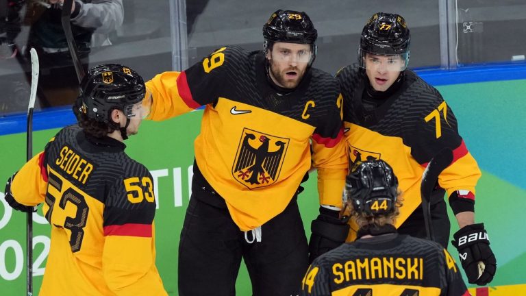 Germany's Leon Draisaitl (29) is congratulated after scoring a goal against France during the first period of a men's ice hockey qualification playoff game at the 2026 Winter Olympics, in Milan, Italy, Tuesday, Feb. 17, 2026. (Carolyn Kaster/AP Photo)