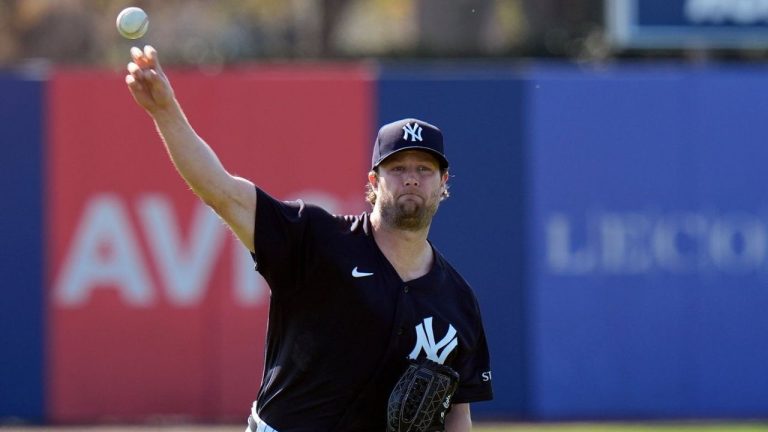 New York Yankees pitcher Gerrit Cole warms up before a bullpen session during a spring training baseball workout Friday, Feb. 13, 2026, in Tampa, Fla. (Chris O'Meara/AP)
