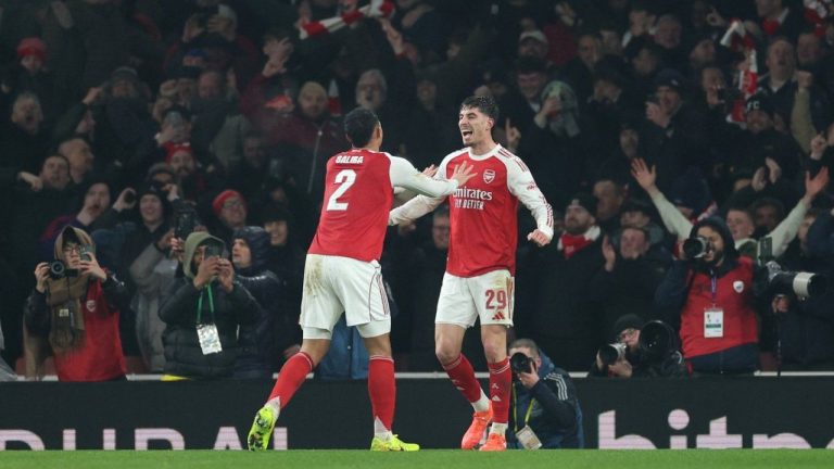 Arsenal's Kai Havertz, right, celebrates with Arsenal's William Saliba after scoring the opening goal during the English League Cup semifinal second leg soccer match between Arsenal and Chelsea in London, Tuesday, Feb. 3, 2026. (Ian Walton/AP)