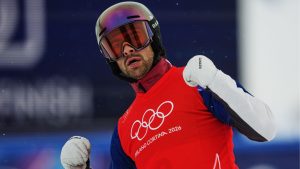 Canada's Eliot Grondin (2) celebrates during the men's snowboard cross finals at the 2026 Winter Olympics, in Livigno, Italy, Thursday, Feb. 12, 2026. (Lindsey Wasson/AP Photo)
