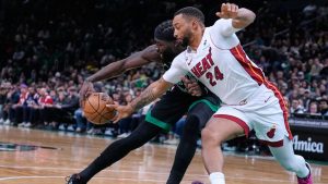 Miami Heat guard Norman Powell (24) steals the ball from Boston Celtics centre Neemias Queta, left, during the first half of an NBA basketball game, Friday, Feb. 6, 2026, in Boston. (Charles Krupa/AP)