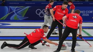 Canada's Brett Gallant, Marc Kennedy and Ben Hebert in action during the men's curling round robin session against Britain at the 2026 Winter Olympics, in Cortina d'Ampezzo, Italy, Tuesday, Feb. 17, 2026. (Fatima Shbair/AP Photo)