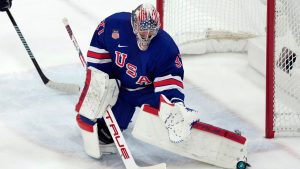 United States goalie Connor Hellebuyck blocks a shot against Sweden during the first period of a men's ice hockey quarterfinal game at the 2026 Winter Olympics, in Milan, Italy, Wednesday, Feb. 18, 2026. (Hassan Ammar/AP Photo)