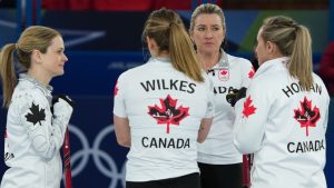 Canada's Rachel Homan, Sarah Wilkes, Tracy Fleury and Emma Miskew compete against the United States during the women's curling round robin session, at the 2026 Winter Olympics, in Cortina d'Ampezzo, Italy, Friday, Feb. 13, 2026. (Misper Apawu/AP Photo)