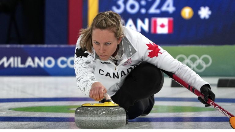 Canada's Rachel Homan in action during the women's curling round robin session against Sweden, at the 2026 Winter Olympics, in Cortina d'Ampezzo, Italy, Tuesday, Feb. 17, 2026. (Misper Apawu/AP Photo)