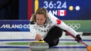 Canada's Rachel Homan in action during the women's curling round robin session against Sweden, at the 2026 Winter Olympics. (Misper Apawu/AP)