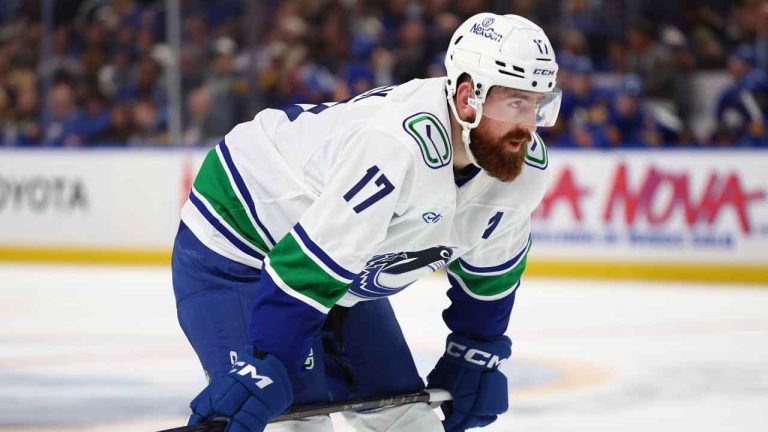 Vancouver Canucks defenseman Filip Hronek (17) lines up for a faceoff during the second period of an NHL hockey game against the Buffalo Sabres. (Jeffrey T. Barnes/AP)