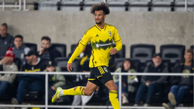 Columbus Crew forward Jacen Russell-Rowe runs downfield while controlling the ball during the second half of Game 2 in the first round of MLS soccer's Eastern Conference playoffs against FC Cincinnati, Sunday, Nov. 2, 2025, in Columbus. (Tanner Pearson/AP)