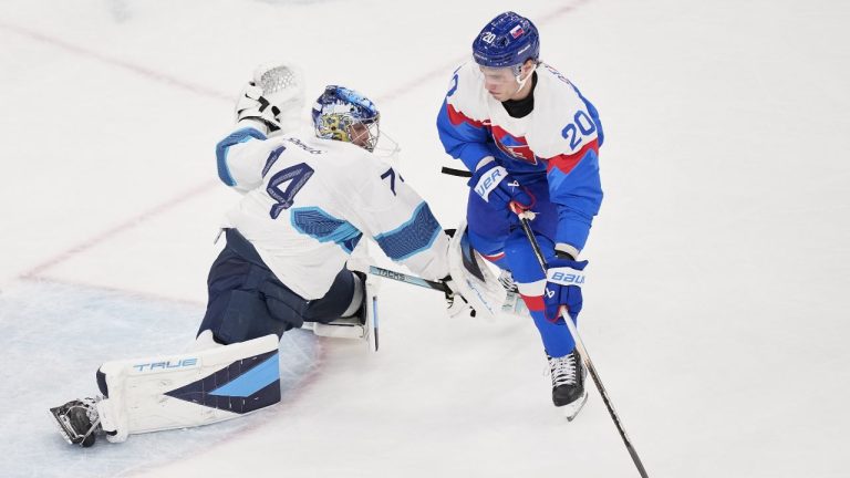 Slovakia's Juraj Slafkovsky (20) scores her side's opening goal during a preliminary round match of men's ice hockey between Slovakia and Finland at the 2026 Winter Olympics, in Milan, Italy, Wednesday, Feb. 11, 2026. (Petr David Josek/AP)
