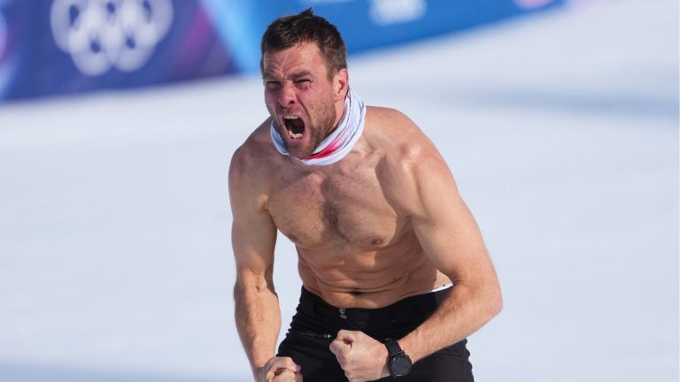Austria's Benjamin Karl celebrates winning the gold medal in the men's snowboarding parallel giant slalom finals at the 2026 Winter Olympics, in Livigno, Italy, Sunday, Feb. 8, 2026. (Lindsey Wasson/AP Photo)