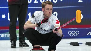 Canada's Marc Kennedy in action during the men's curling round robin session against China, at the 2026 Winter Olympics, in Cortina d'Ampezzo, Italy, Sunday, Feb. 15, 2026. (Misper Apawu/AP Photo)