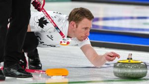 Canada's Marc Kennedy in action during the men's curling round robin session against Czechia, at the 2026 Winter Olympics, in Cortina d'Ampezzo, Italy, Monday, Feb. 16, 2026. (Misper Apawu/AP Photo)