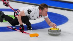 Canada's Marc Kennedy competes in a men's curling semifinal match against Norway at the 2026 Winter Olympics, in Cortina d'Ampezzo, Italy, Thursday, Feb. 19, 2026. (Misper Apawu/AP Photo)