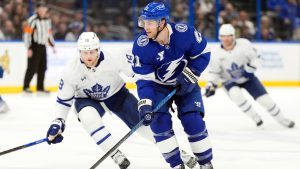 Tampa Bay Lightning centre Brayden Point (21) controls the puck in front of Toronto Maple Leafs right wing William Nylander (88) during the first period of an NHL hockey game Wednesday, Feb. 25, 2026, in Tampa, Fla. (Chris O'Meara/AP)