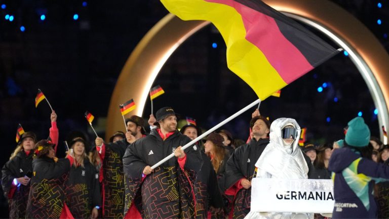 Leon Draisaitl, flag bearer of Germany arrives during the Olympic opening ceremony at the 2026 Winter Olympics, in Milan, Italy, Friday, Feb. 6, 2026. (Natacha Pisarenko/AP)