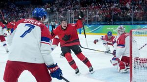 Canada's Macklin Celebrini (17) celebrates his goal against Czechia goalie Lukas Dostal (1) during the first period of a quarterfinal men's hockey game at the 2026 Winter Olympics, in Milan, on Wednesday, Feb. 18, 2026. (Darryl Dyck/CP)