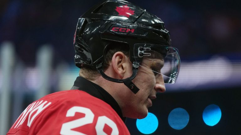Canada's Nathan MacKinnon (29) leaves the ice after warm up before taking on Switzerland during a preliminary round men's hockey game at the 2026 Winter Olympics, in Milan, on Friday, Feb. 13, 2026. (Darryl Dyck/THE CANADIAN PRESS)