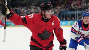 Canada's Cale Makar (8) celebrates after scoring during a men's ice hockey gold medal game between Canada and the United States at the 2026 Winter Olympics, in Milan, Italy, Sunday, Feb. 22, 2026. (Hassan Ammar/AP)