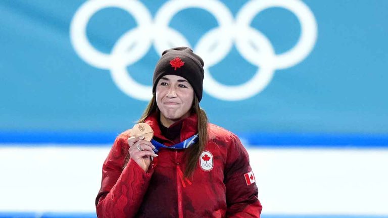 Canada's Valerie Maltais celebrates with her bronze medal in the women's 3000m speed skating competition during the 2026 Milano Cortina Winter Olympics in Milan. (Nathan Denette/ THE CANADIAN PRESS)