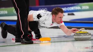 Canada's Marc Kennedy competes during a men's curling gold medal match between Britain and Canada, at the 2026 Winter Olympics. (Misper Apawu/AP)