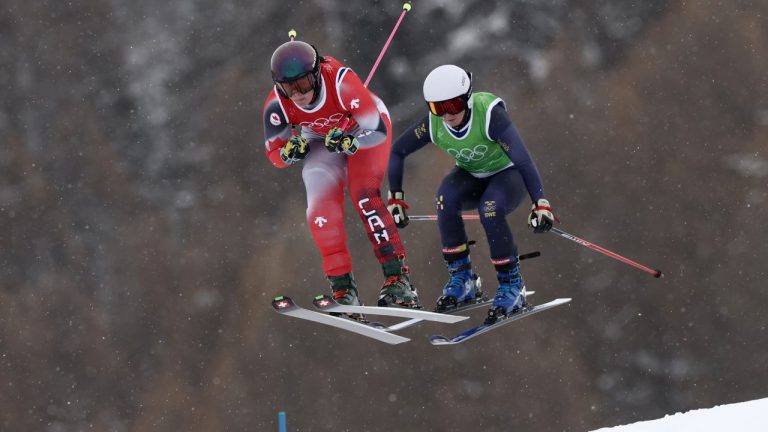 Canada's Marielle Thompson (8), left, and Sweden's Linnea Mobaerg (9) compete during the women's ski cross finals at the 2026 Winter Olympics, in Livigno, Italy, Friday, Feb. 20, 2026. (Gabriele Facciotti/AP)