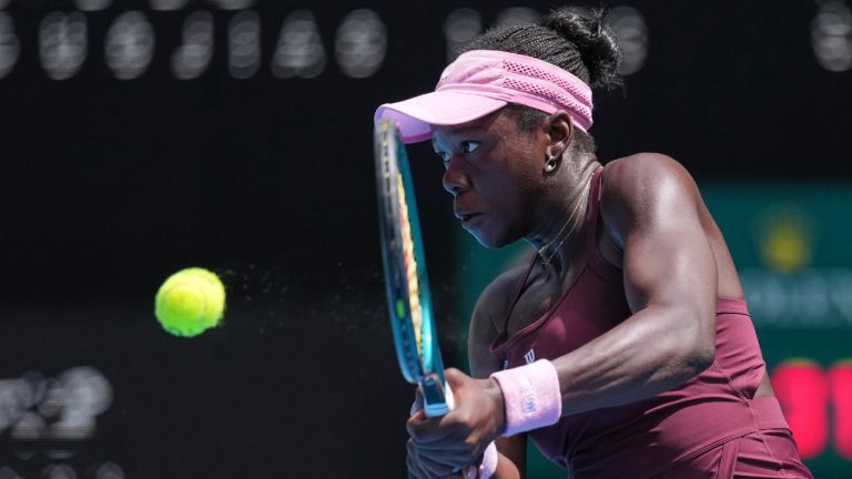 Victoria Mboko of Canada plays a backhand return to Aryna Sabalenka of Belarus during their fourth round match at the Australian Open tennis championship in Melbourne, Australia, Sunday, Jan. 25, 2026. (Dita Alangkara/AP)