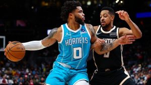 Charlotte Hornets forward Miles Bridges dribbles against Atlanta Hawks guard CJ McCollum, right, during the first half of an NBA game, Saturday, Feb. 7, 2026, in Atlanta. (AP/Colin Hubbard)