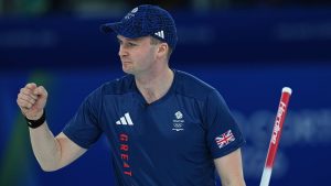 Great Britain's Bruce Mouat celebrates after winning the mixed doubles round robin phase of the curling competition against Canada at the 2026 Winter Olympics, in Cortina d'Ampezzo, Italy, Saturday, Feb. 7, 2026. (Fatima Shbair/AP Photo)
