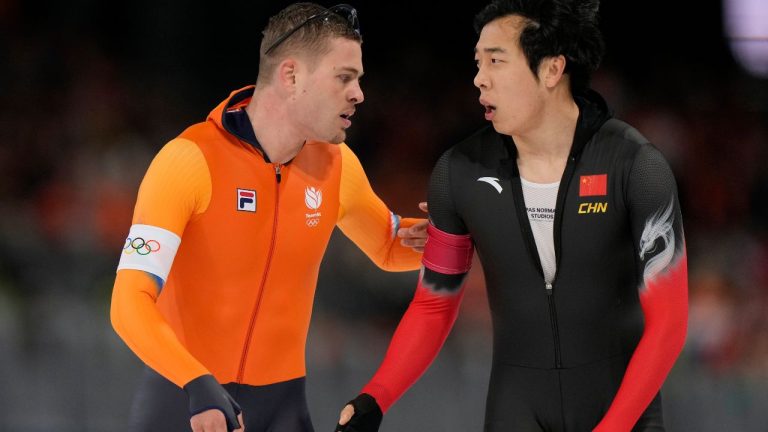 Joep Wennemars of the Netherlands, left, argues with Lian Ziwen of China competes in the men's 1,000 meters speedskating race at the 2026 Winter Olympics, in Milan, Italy, Wednesday, Feb. 11, 2026. (Luca Bruno/AP Photo)