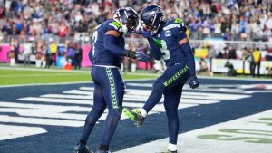 Seattle Seahawks linebacker Uchenna Nwosu (7) celebrates his touchdown on a fumble recovery with safety Nick Emmanwori (3) runs during the second half of the NFL Super Bowl 60 football game, Sunday, Feb. 8, 2026, in Santa Clara, Calif. (AP Photo/Mark J. Terrill)