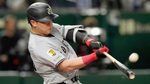  Yomiuri Giants' Kazuma Okamoto flies out in the fourth inning of a spring training baseball game against the Los Angeles Dodgers in Tokyo. (Hiro Komae/AP)