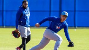 Toronto Blue Jays Vladimir Guerrero Jr. watches as Kazuma Okamoto chases down a ground ball in a first base drill at Spring Training in Dunedin, Fla. on Friday Feb. 20, 2026. (Frank Gunn/CP)